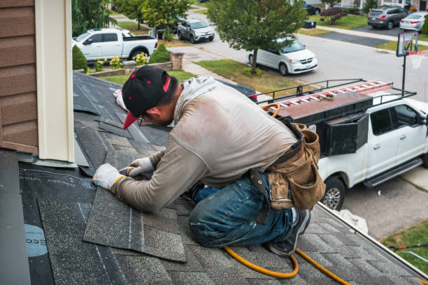 Professional Roofing technician working in East Islip, NY